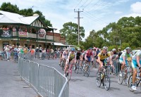 cycling peloton of the Tour Down Under passes through local towns during the event